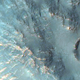 Crater in Hesperia Planum. Photo credit: NASA/JPL/University of Arizona